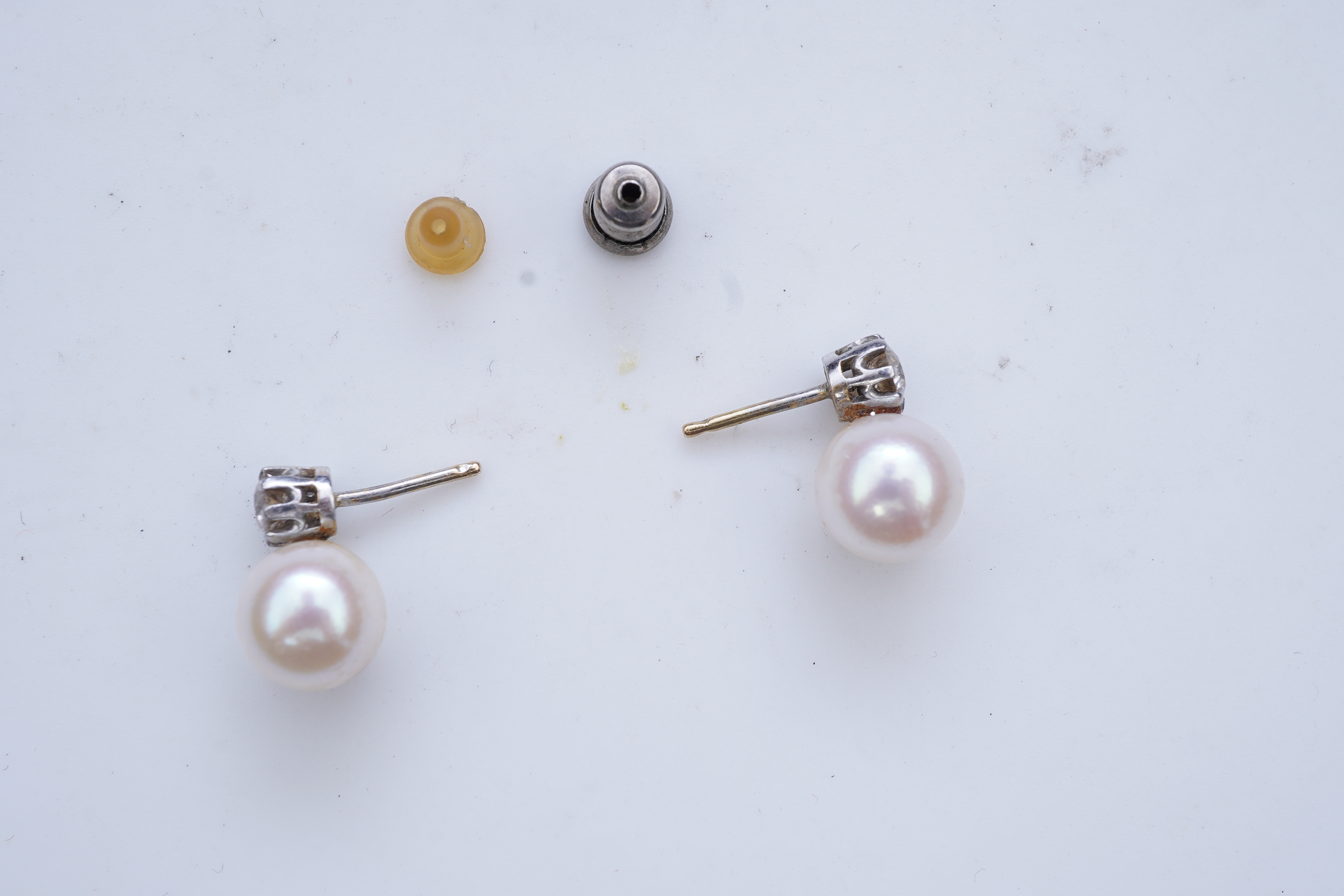 A pair of cultured pearl and diamond earrings